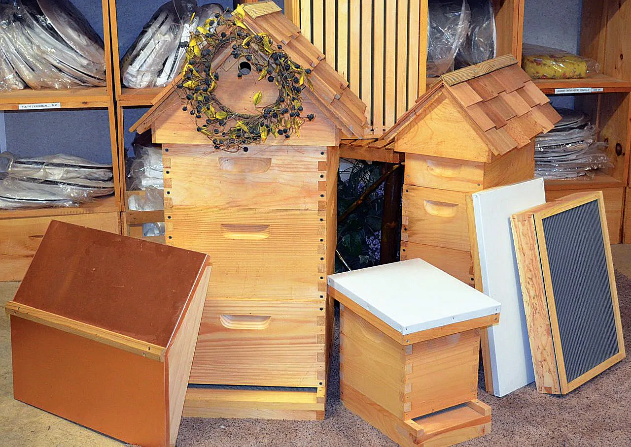 Wooden hive bodies, roofs and bottom boards on display in the store