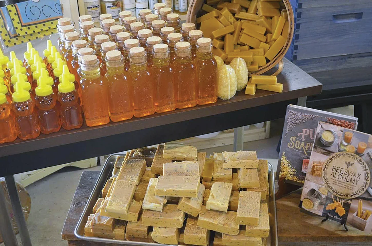 Jars of honey and bars of beeswax on a store table